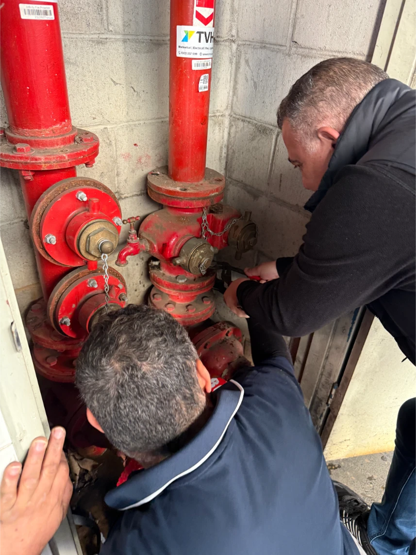 Experts working on pipes fitting
