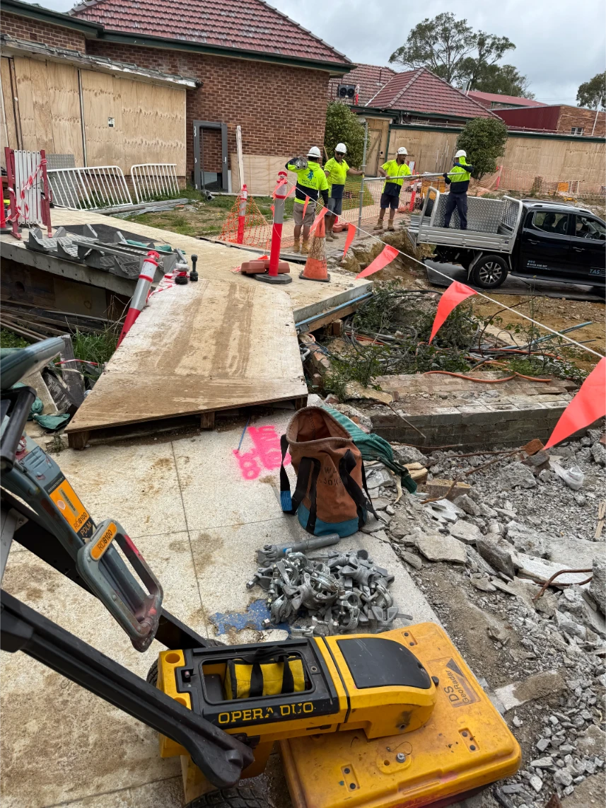 Engineer using ground penetrating radar (GPR) for underground utility mapping.